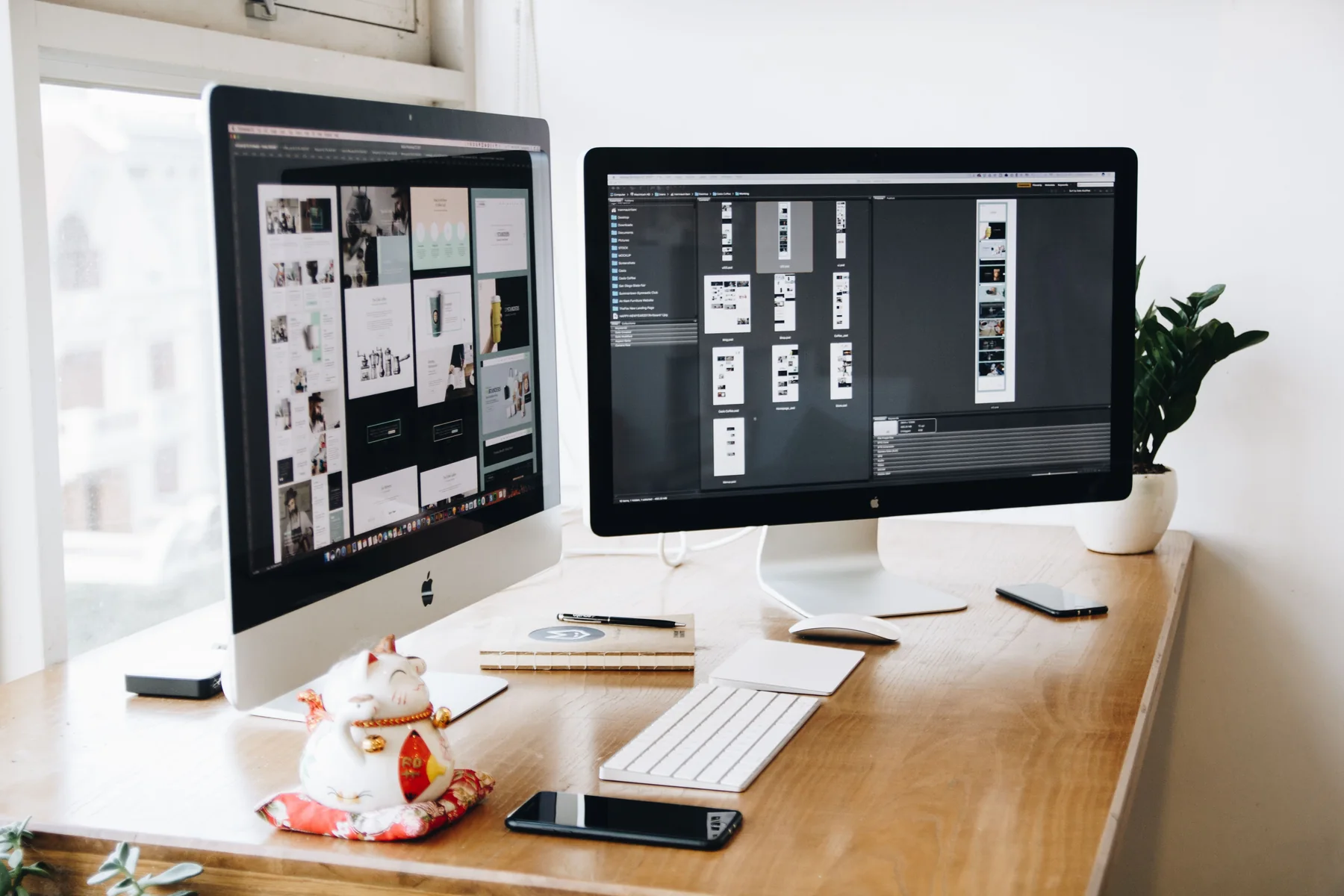 Two desktop computers displaying website designs