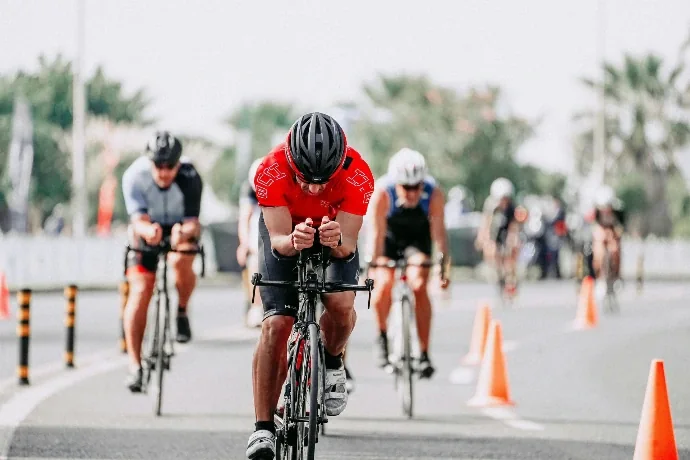 A cyclist leading a race, representing competitive edge