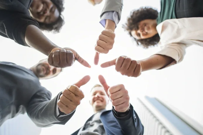 A team showing approval, representing trust and credibility