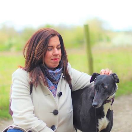Zsuzsanna Pataki outdoors with a dog